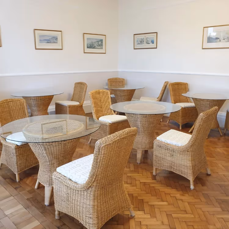 Hotel dining room with rattan furniture