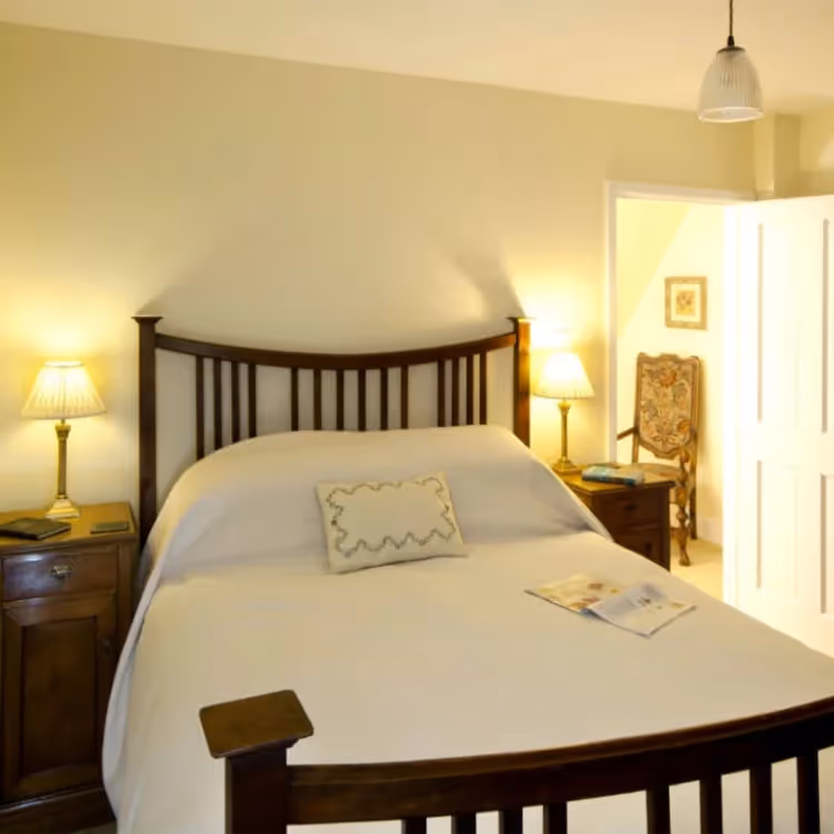 A traditional bedroom with a wooden bed