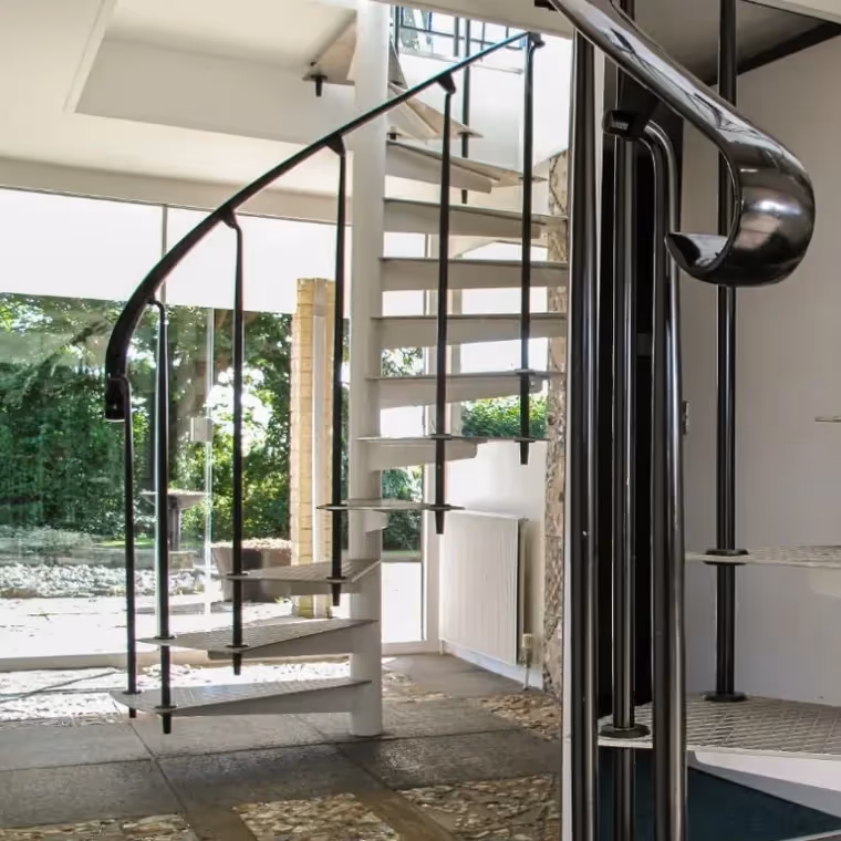 A spiral staircase in a 1970s home