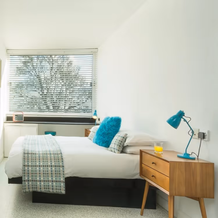 A modern bedroom with 1970s furniture