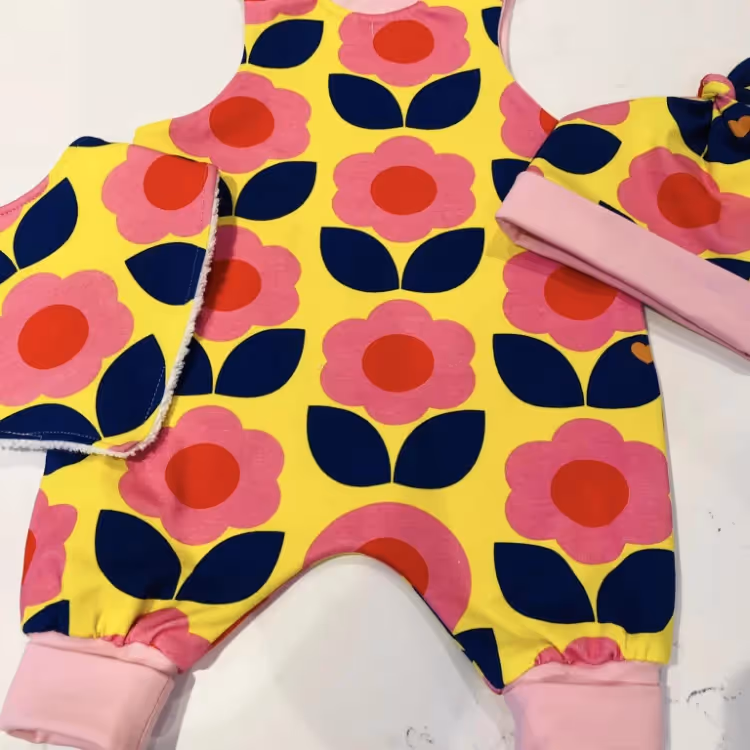 A bold yellow & pink romper suit