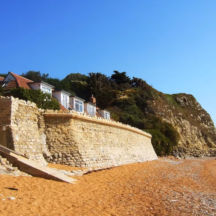 A stone coastguards house on a beach