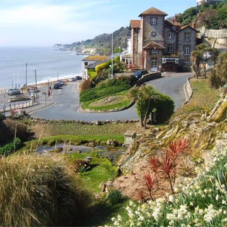 A winding road leading down to the sea front