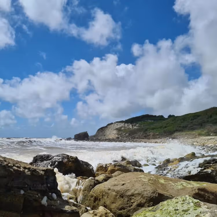 A remote beach with shingle and rocks