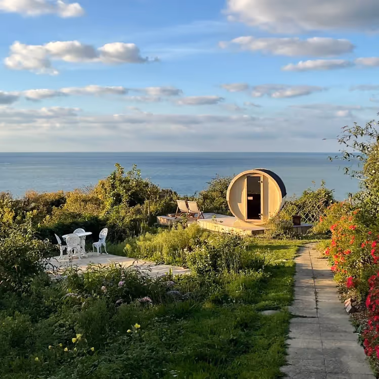 A glamping shepherds hut overlooking the sea