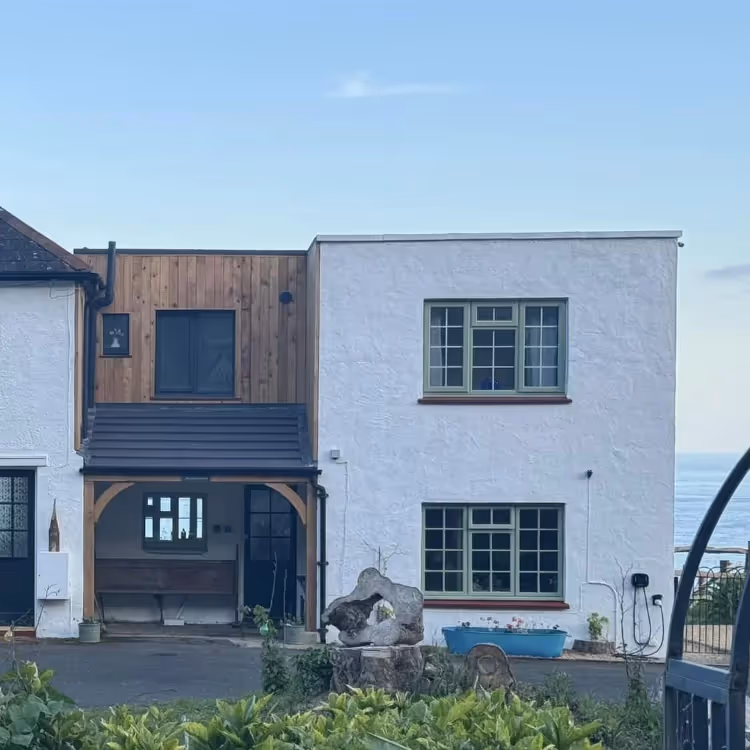 A modern house on an elevated position overlooking the sea
