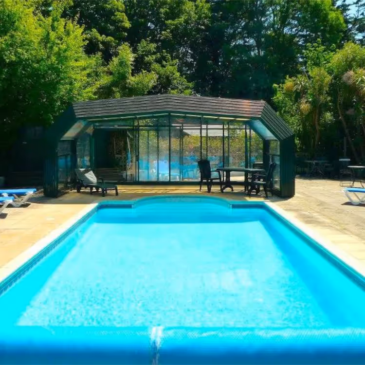 The outdoor swimming pool of a large house