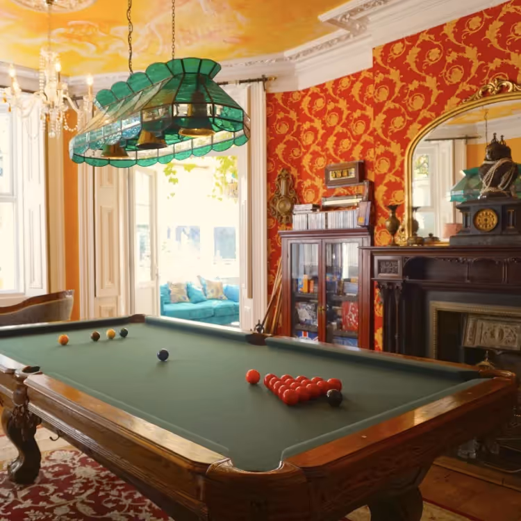 A grand games room with billiards table