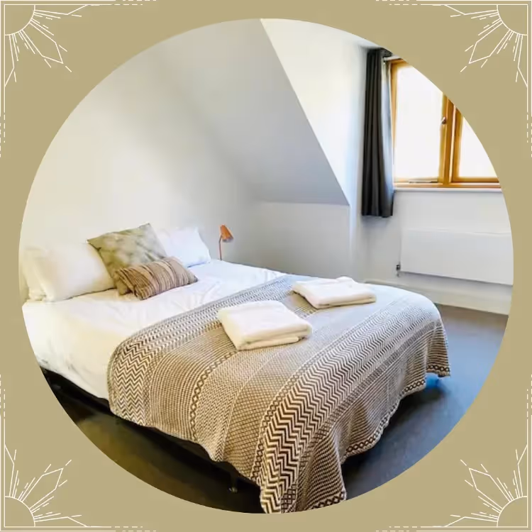 A photo of a bedroom within a circular graphic