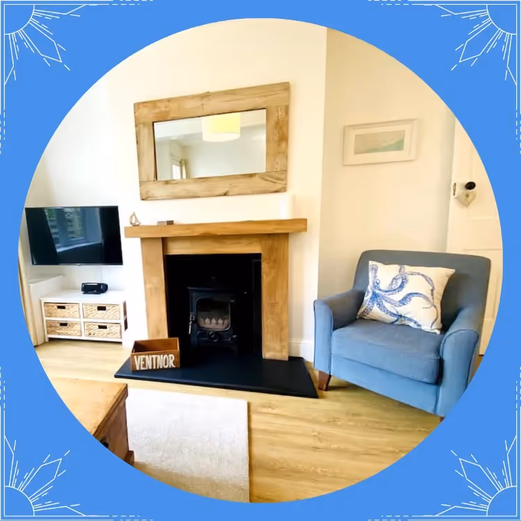 A photo of a fireplace and cosy armchair in a circular graphic