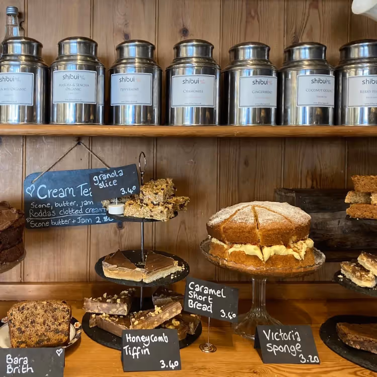 A selection of teas and cakes in a vintage cafe