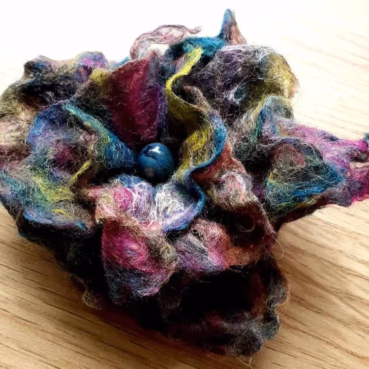 A colourful felted brooch