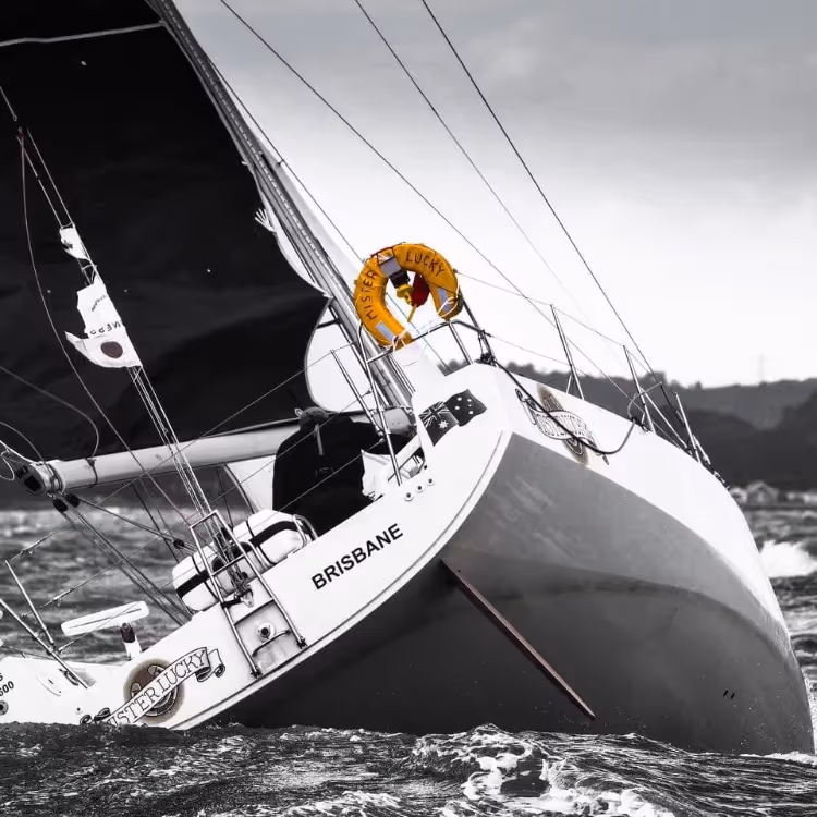 A photo of a yacht racing on the sea