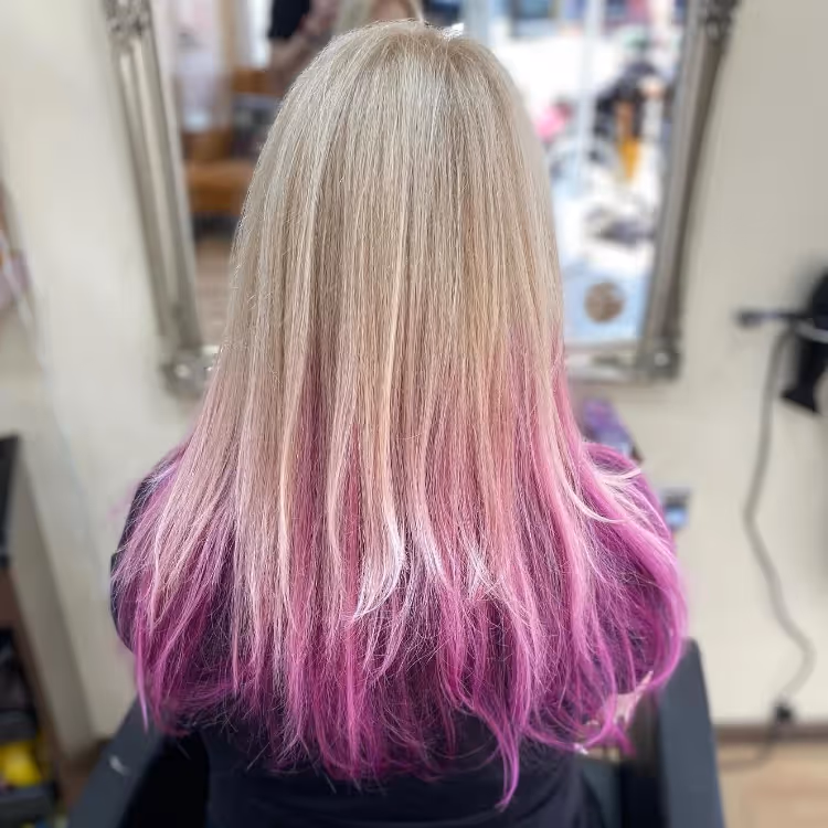 A lady with purple and blonde ombre hair colours