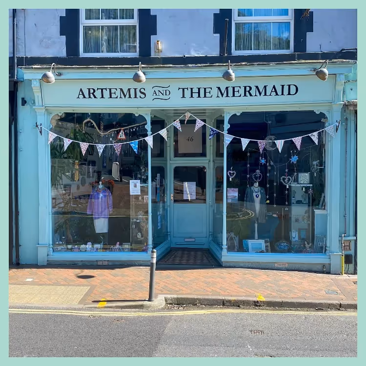 The aqua painted exterior of a gift shop