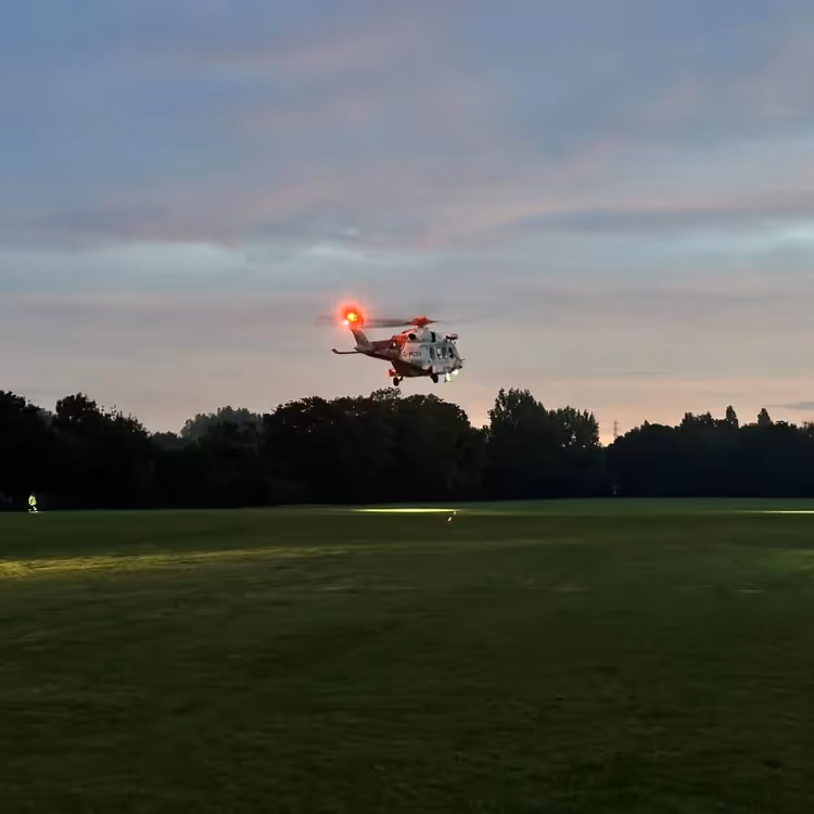 A rescue helicopter operating at dusk