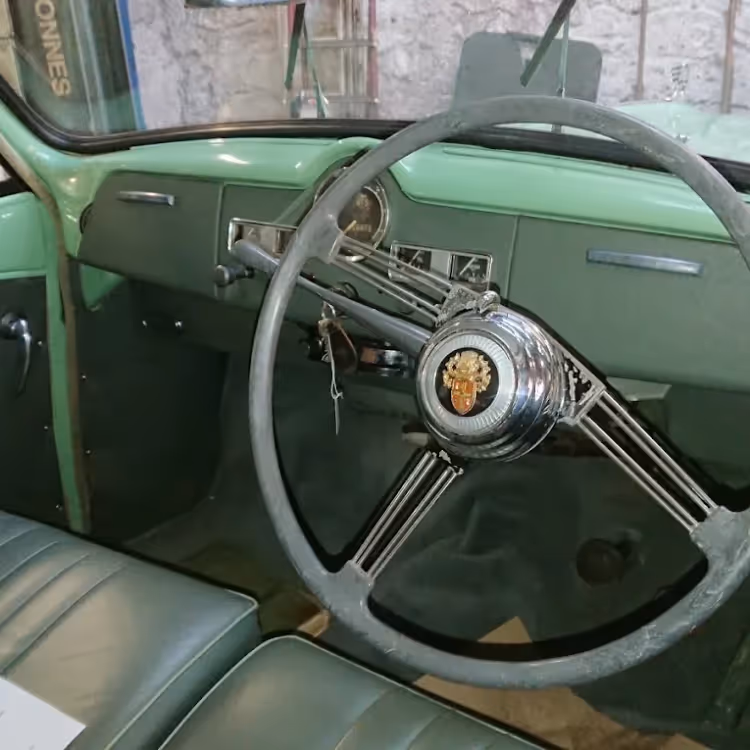 The green interior of a vintage car