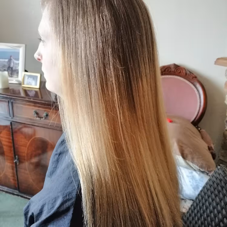 A lady with long blonde hair