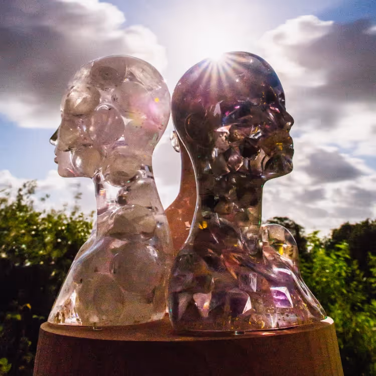 Three resin sculptures caught in light