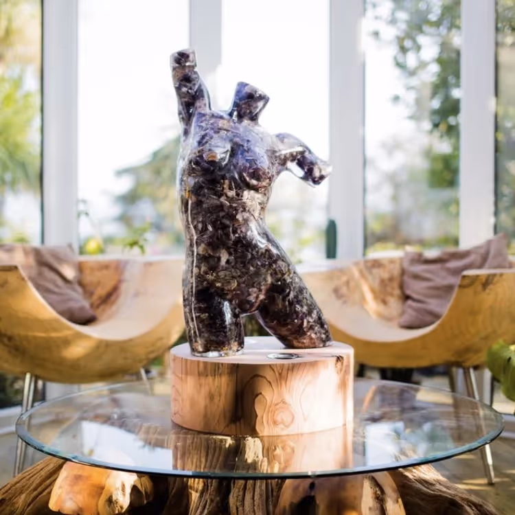 A figure made from resin in shades of purple