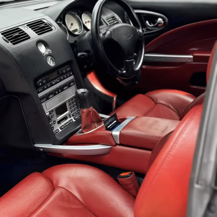 A car interior with red leather seats