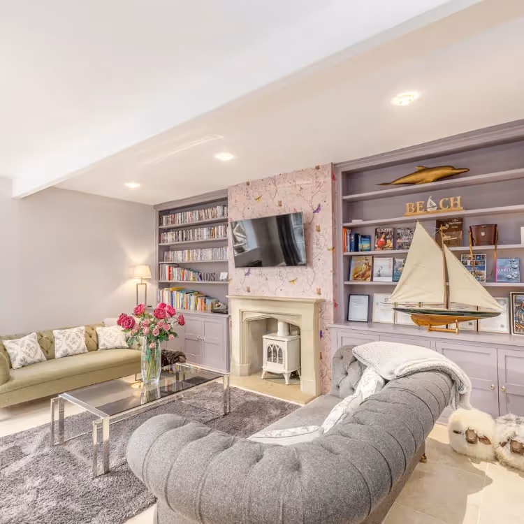 A pretty living room decorated in grey and pink