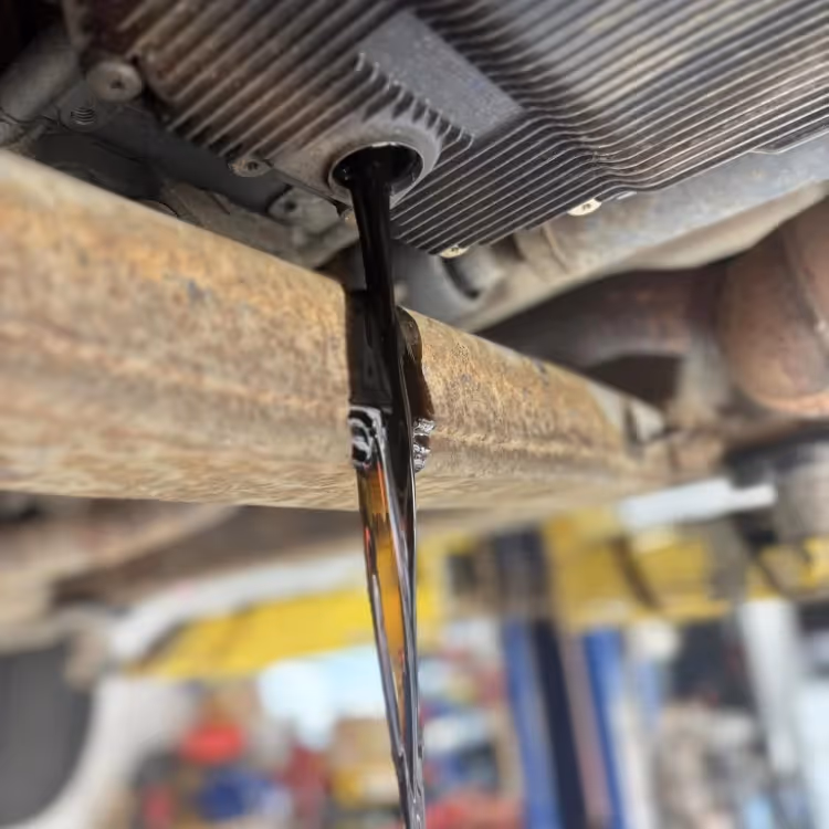Oil being drained from an engine