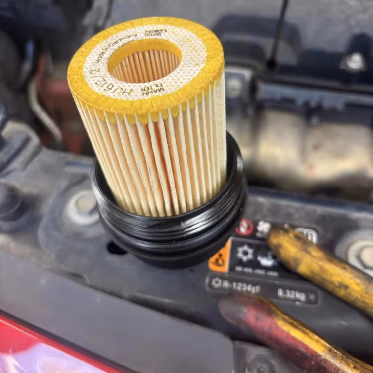 A new air filter being fitted to an engine