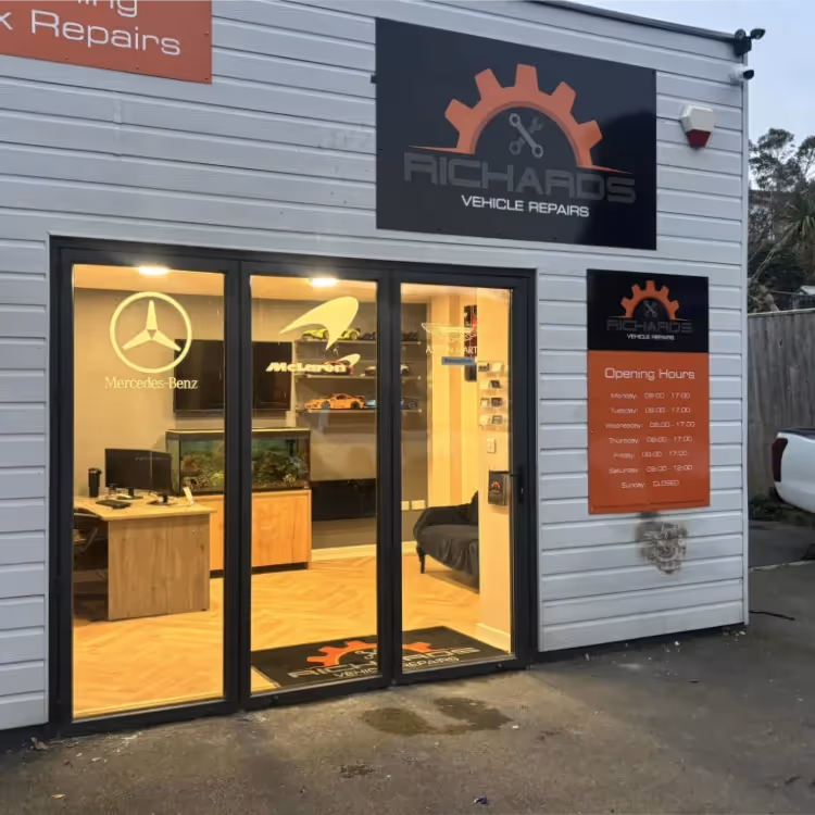 The entrance doorway of a vehicle repair shop