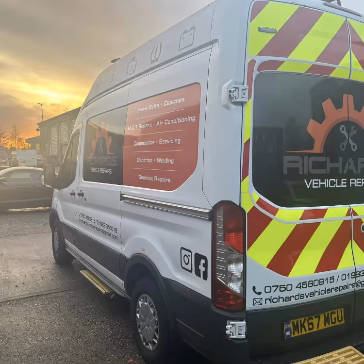 A mechanic's van parked outside his workshop