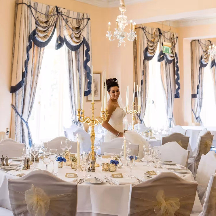 A bride walking around a wedding banquet room