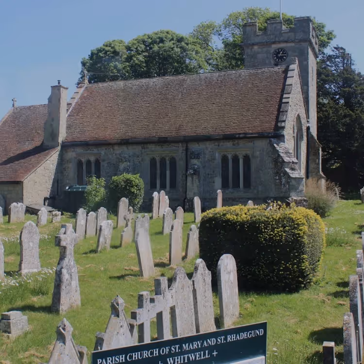 A church with gravestones in the foreground