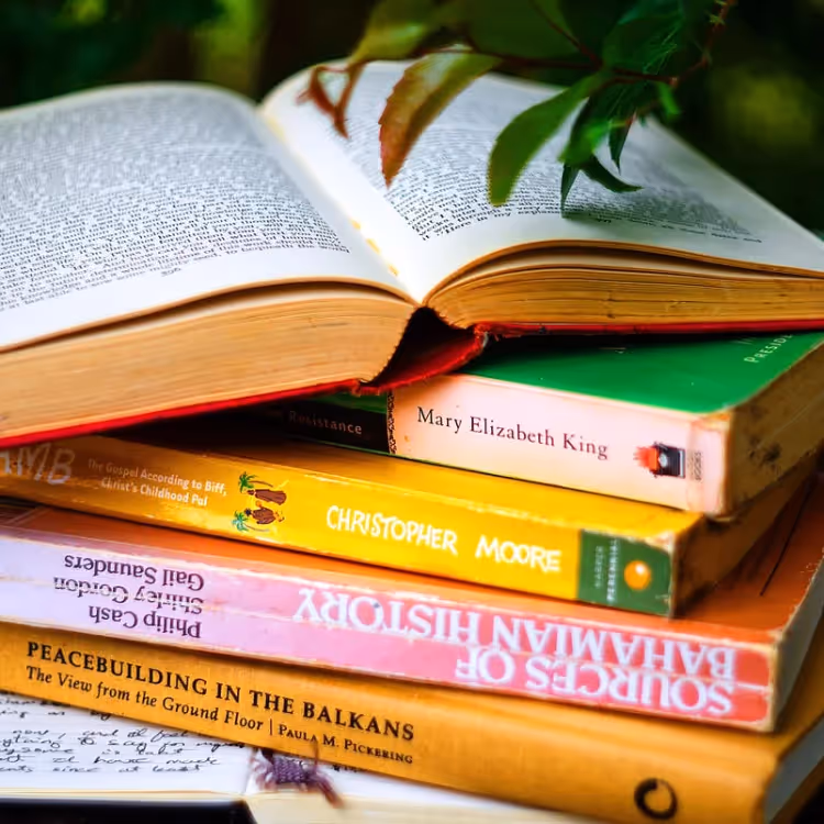 A stack of paperback books
