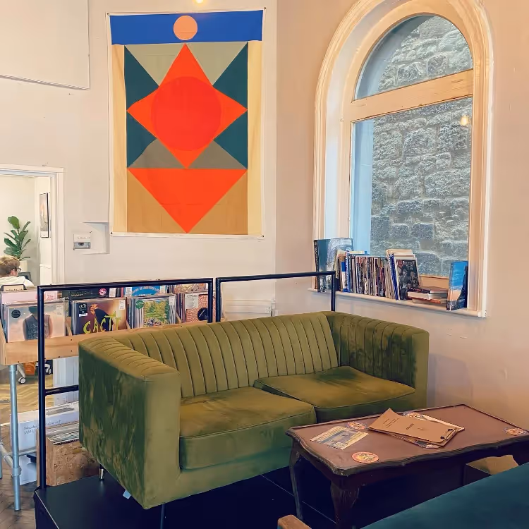 A sofa and coffee table in a trendy bar