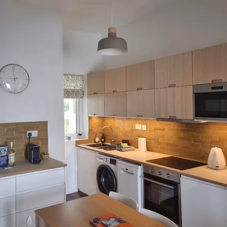 A contemporary styled light oak kitchen
