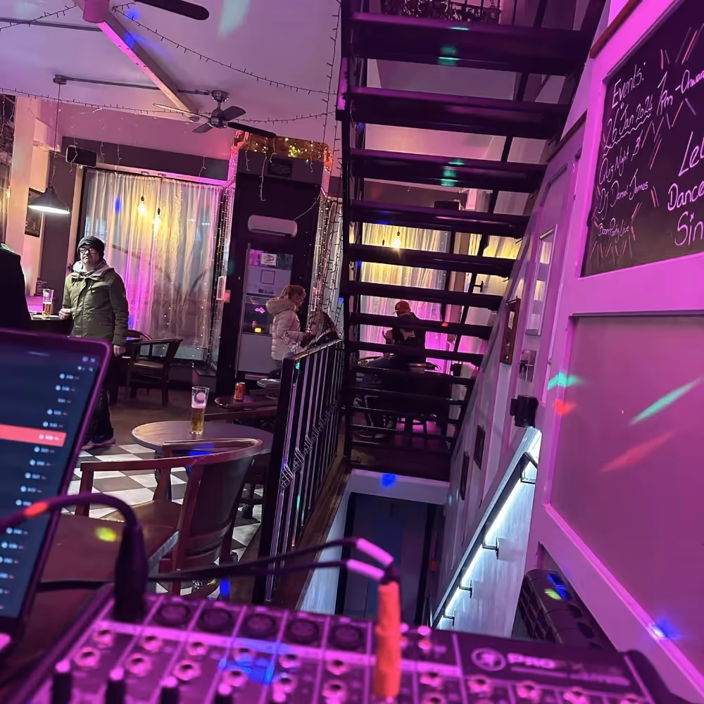 The inside of a town bar with purple LED lighting