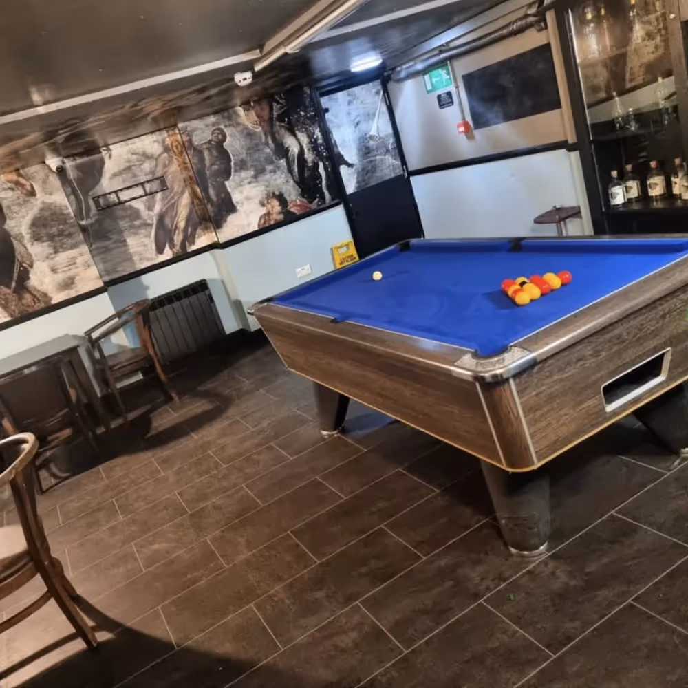 A pool table in a bar