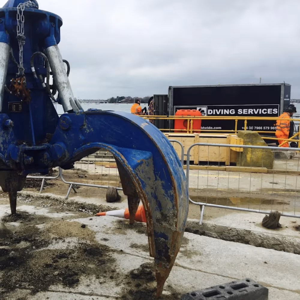 A huge grab lift by a diving barge