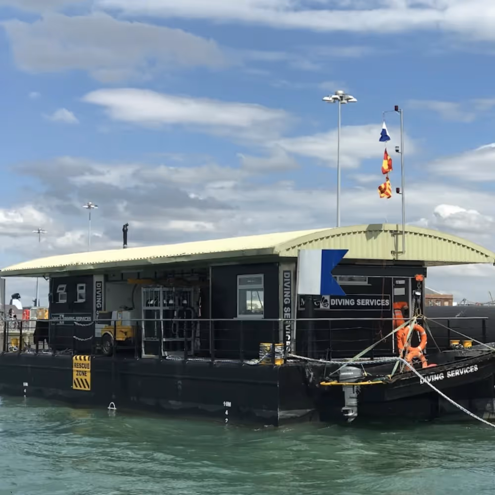 A diving barge on the water