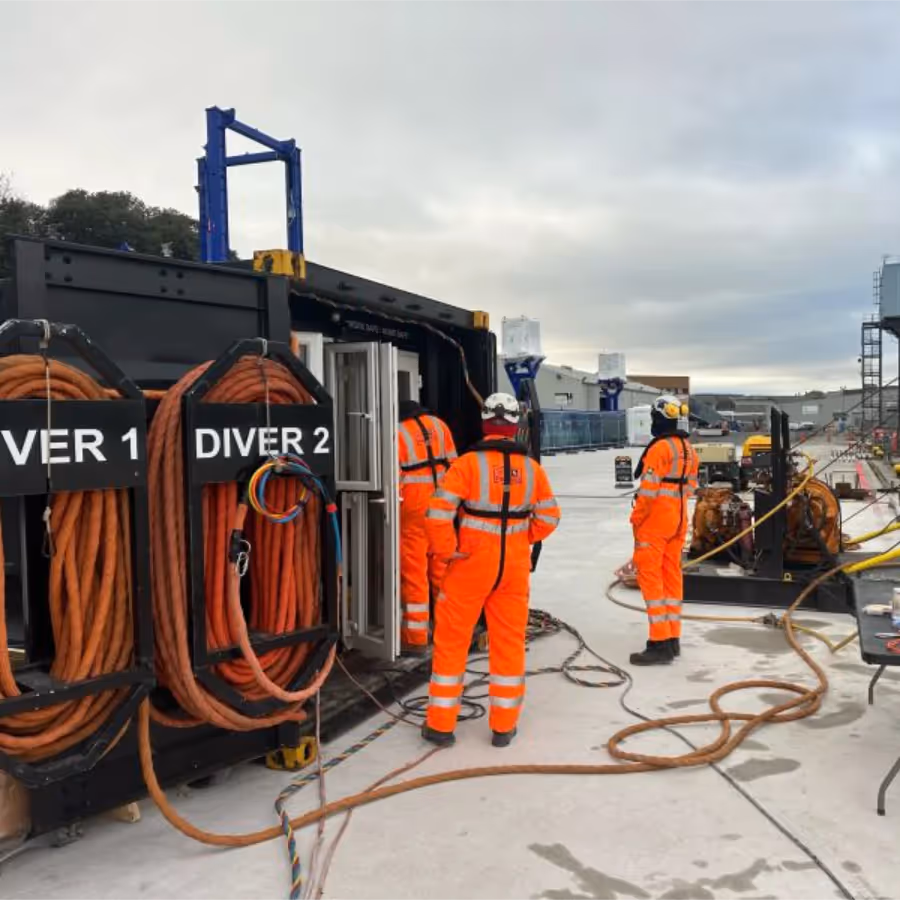 Men assessing their diving equipment