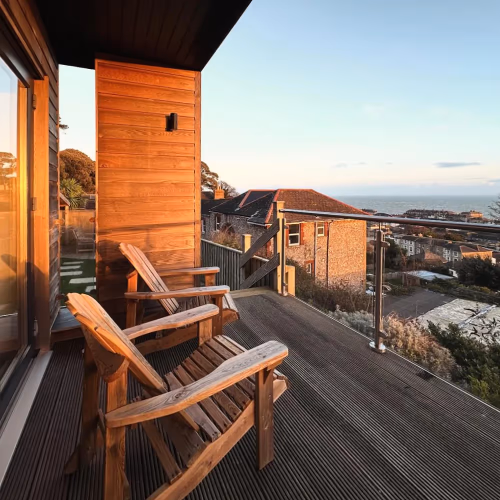 A wooden balcony overlooking the sea