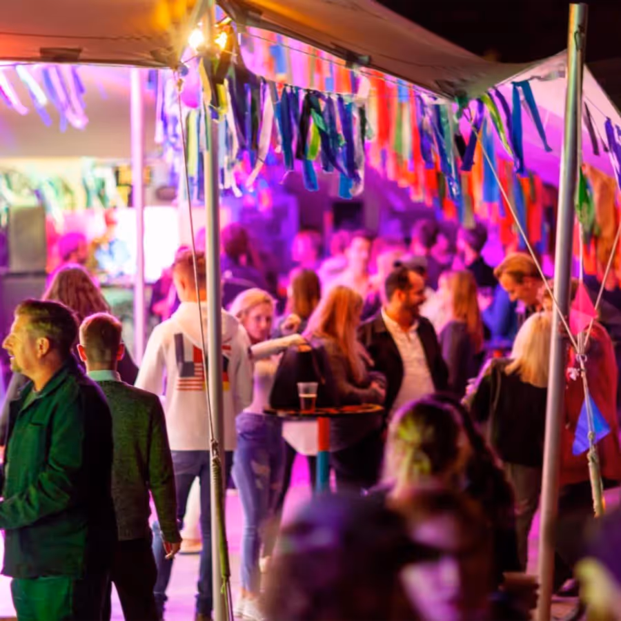 People enjoying a drink at an arts festival