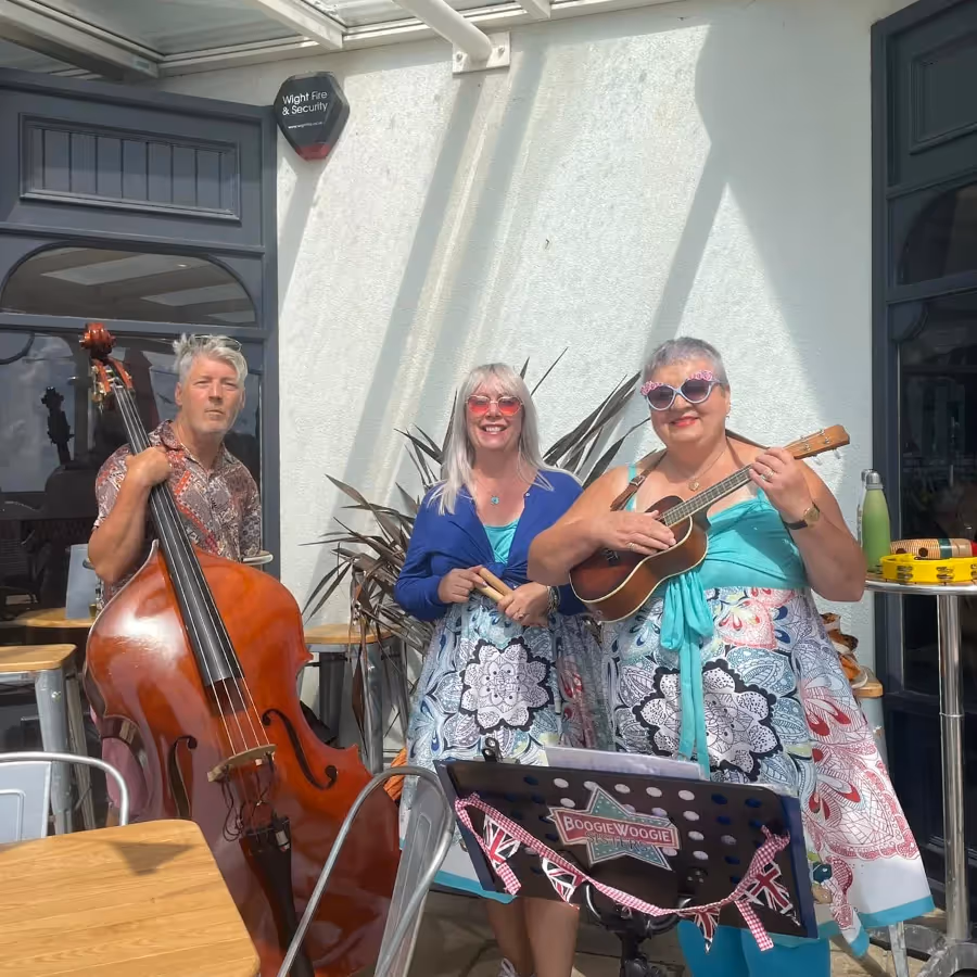 A trio busking outdoors