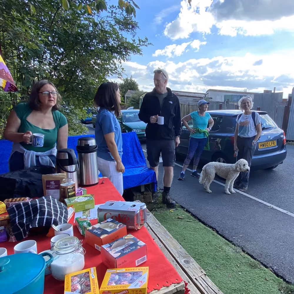 People gathering at a community orchard planting event