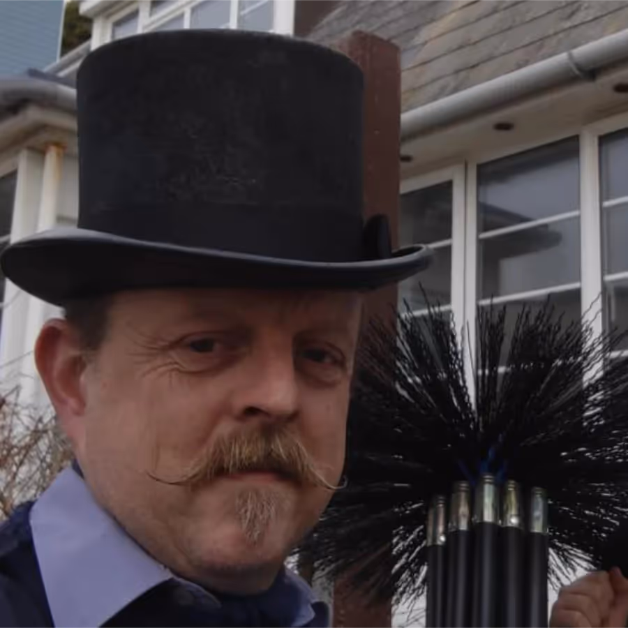 A man wearing a black top hat