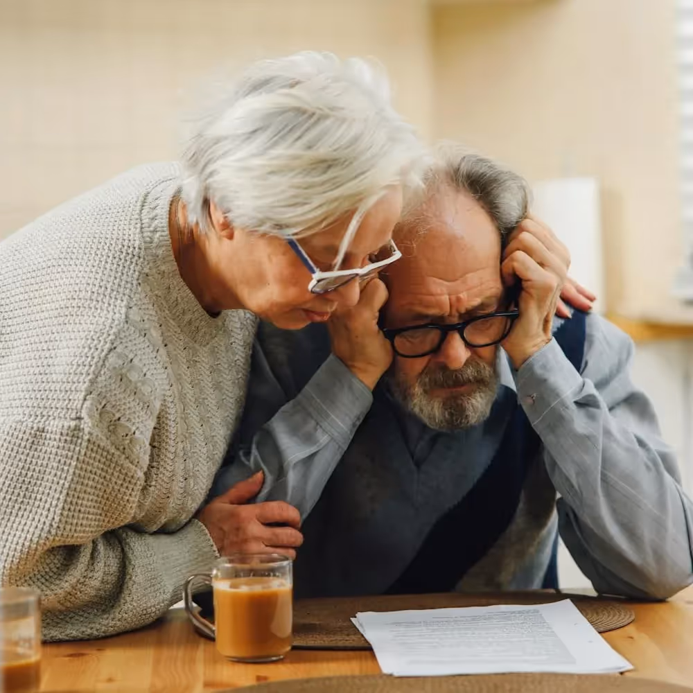 A senior couple worried about paying their bills