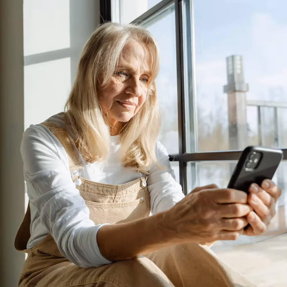 A senior woman looking at her phone