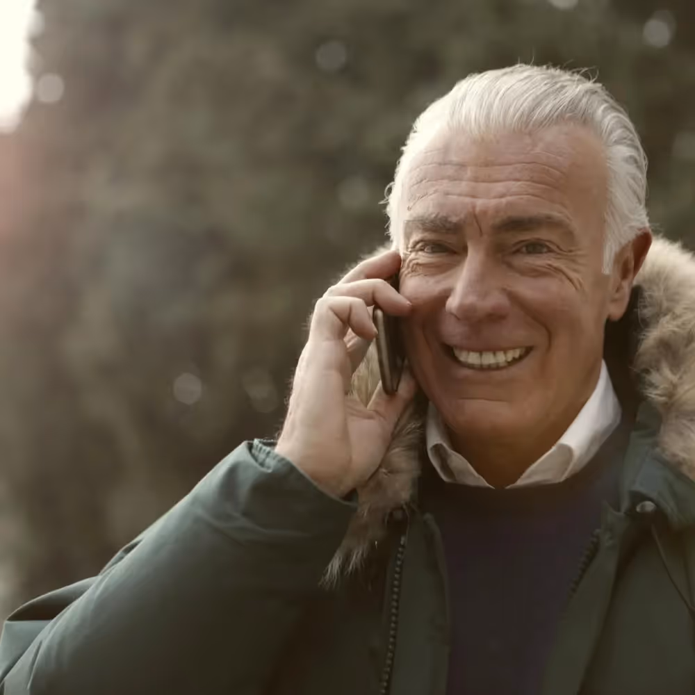 A senior man on the phone