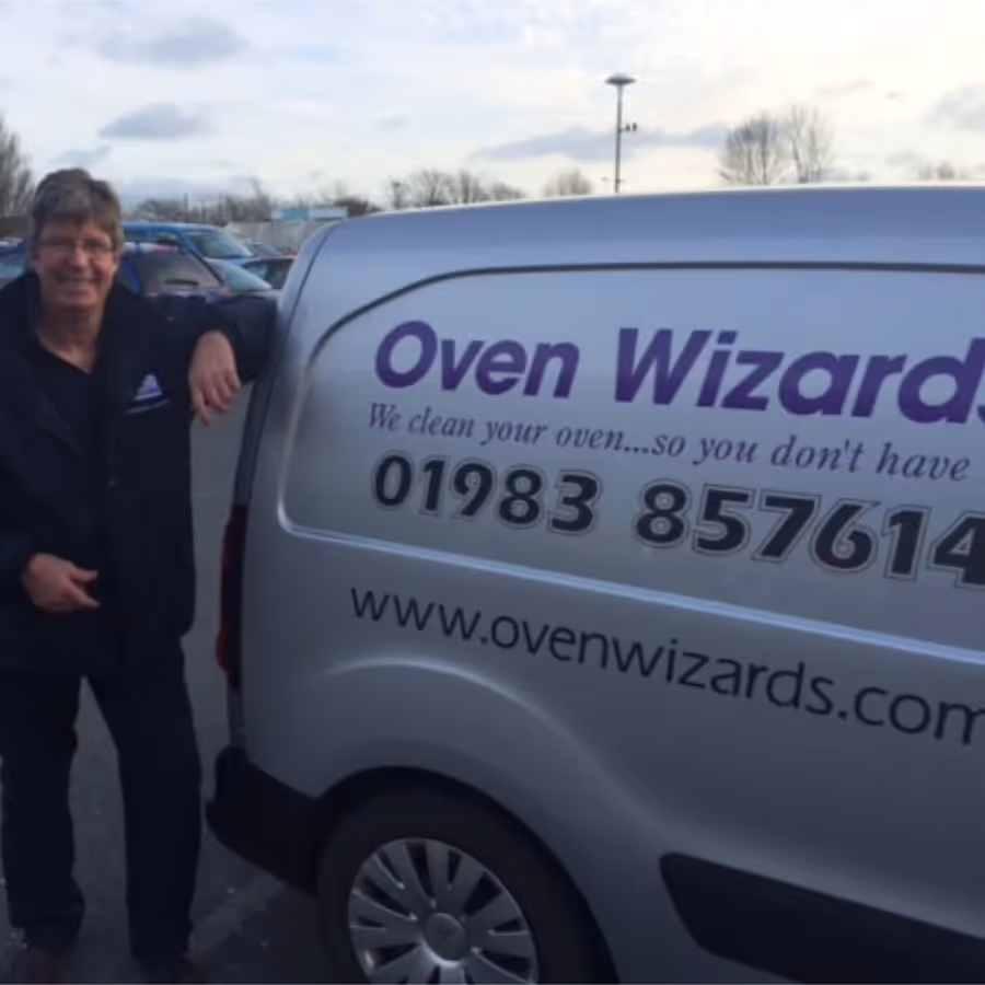 A man stood beside his van