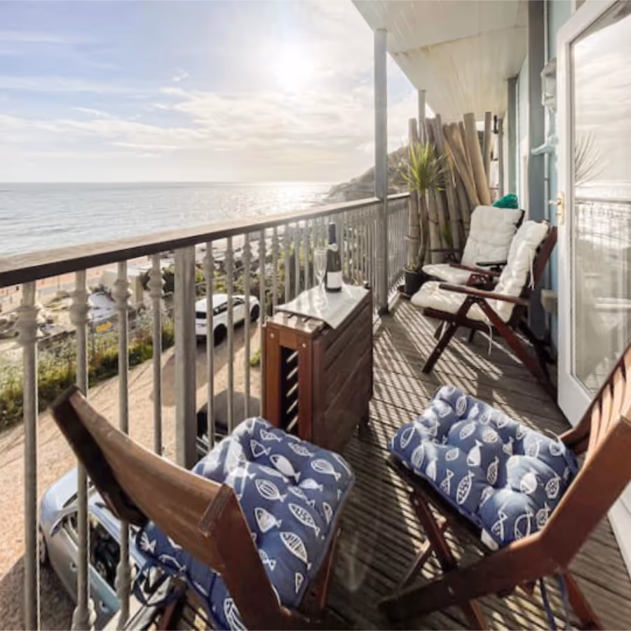 An apartment balcony with a panoramic sea view
